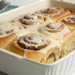 Freshly baked fluffy cinnamon rolls with frosting.