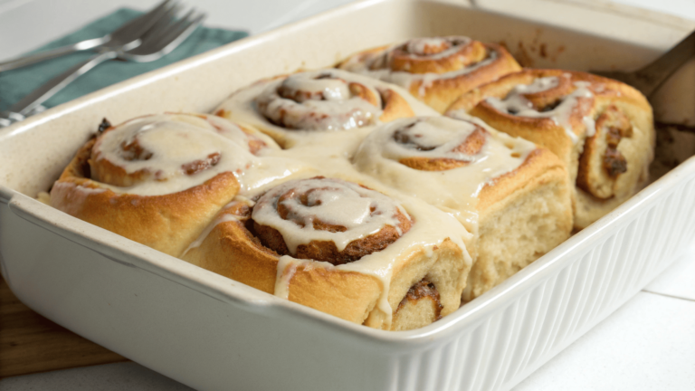 Freshly baked fluffy cinnamon rolls with frosting.